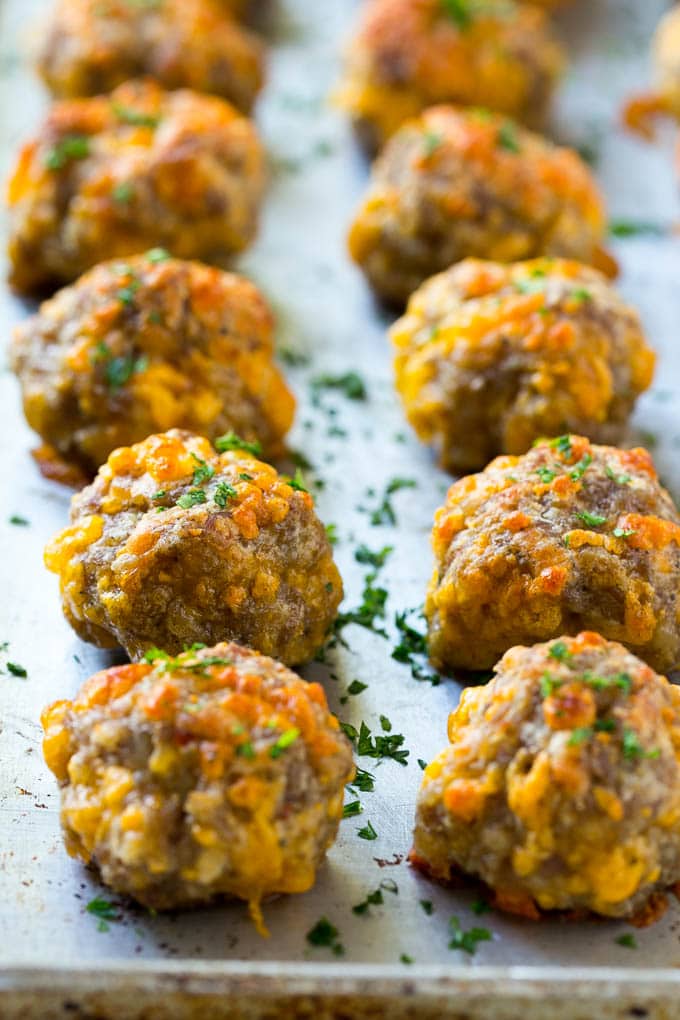 Sausage Cheese Balls Recipe | Sausage Balls Recipe | Bisquick Sausage Balls #sausage #sausageballs #balls #appetizer #cheeseballs #bajap Cooked meatballs on a baking sheet.