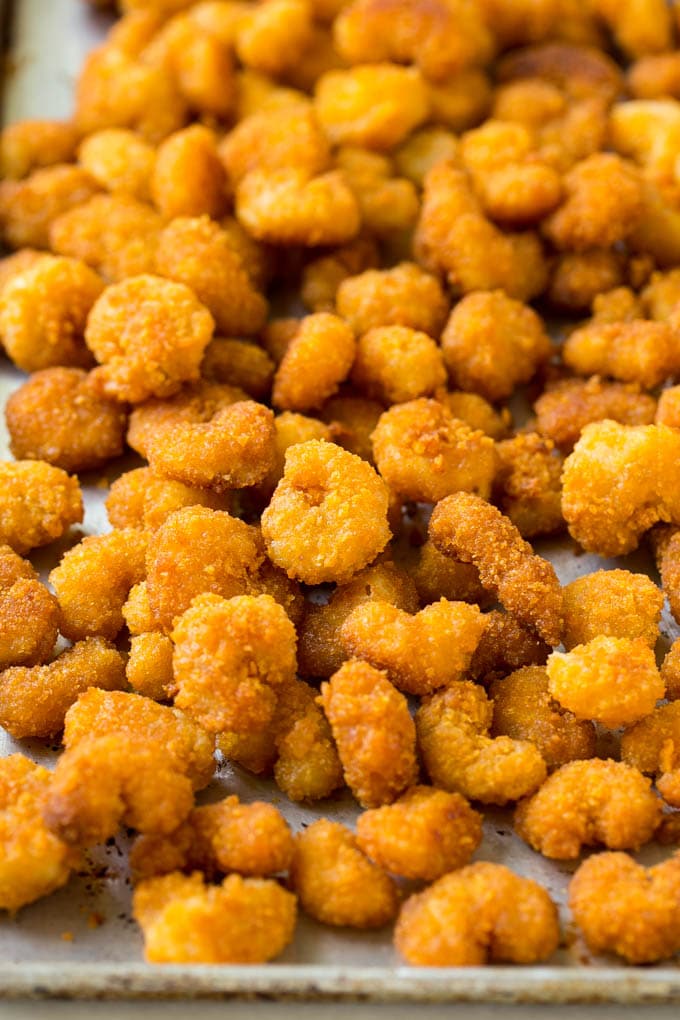 Sesame Shrimp Recipe | Crispy Shrimp | Popcorn Shrimp | Asian Shrimp | Easy Shrimp Recipe #shrimp #fried #friedshrimp #sesameshrimp #crispy #popcornshrimp #chinese #asian #dinner #bajap A pan of cooked popcorn shrimp.