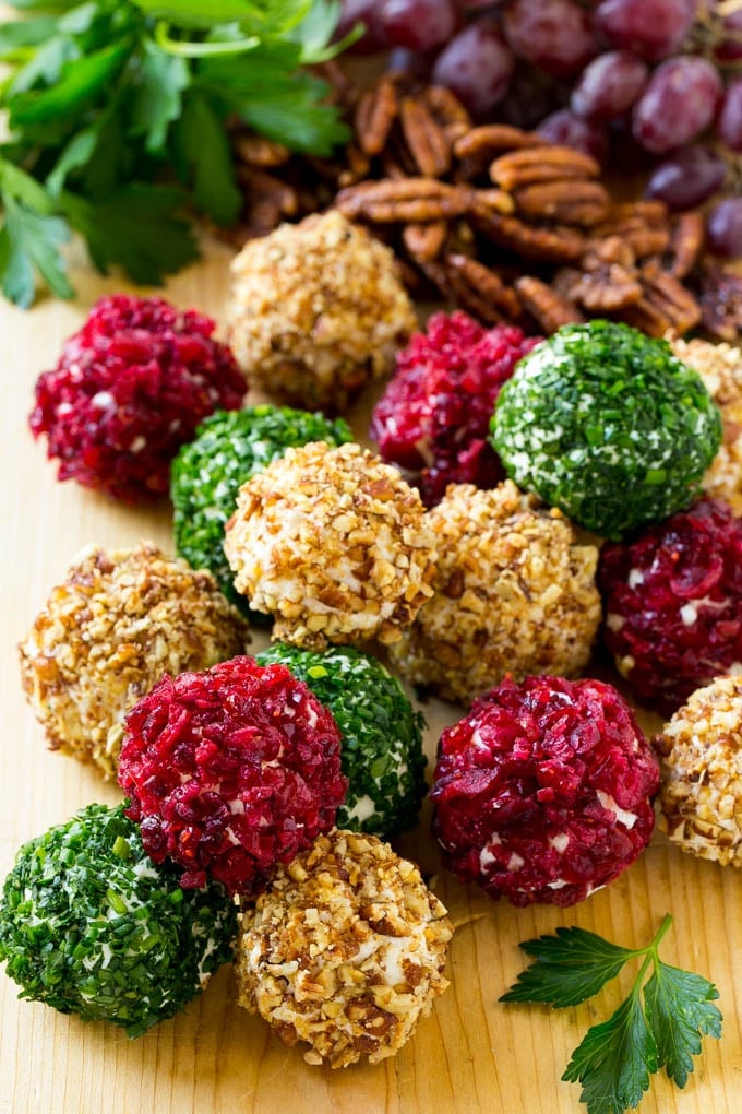 Cheese Ball Bites Recipe | Holiday Cheese Ball Recipe | Pecan Cheese Ball | Cranberry Cheese Ball | Mini Cheese Balls #cheeseball #cheese #appetizer #bajap Cheese ball bites rolled in assorted toppings and served with fruit and nuts.