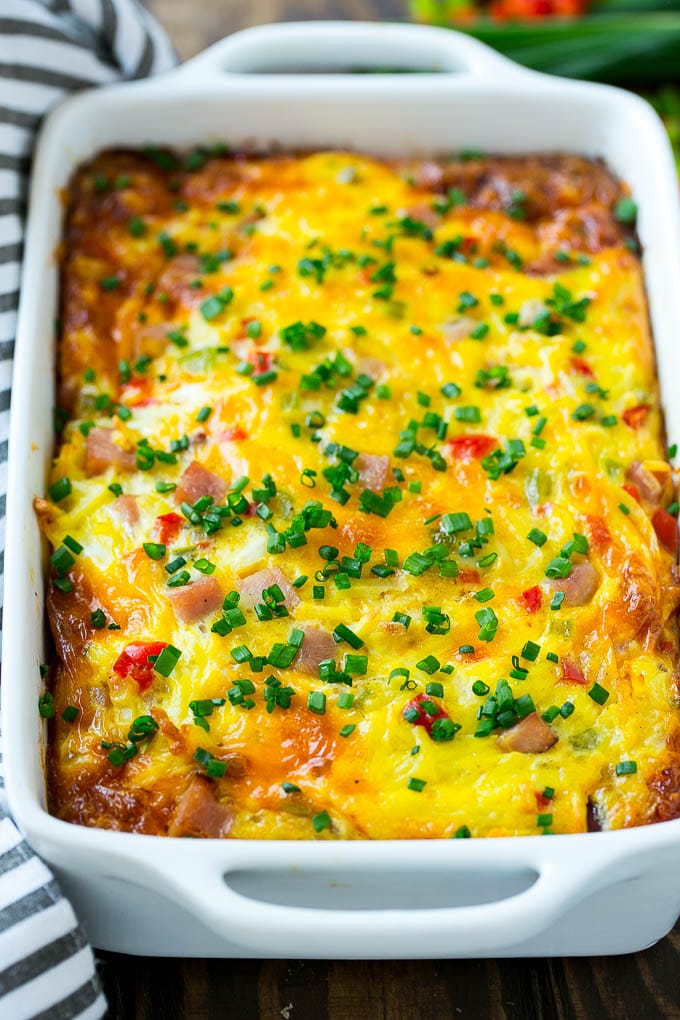 Hash Brown Egg Casserole Recipe | Breakfast Casserole with Ham | Hash Brown Casserole | Ham and Egg Casserole | Egg Casserole with Ham #casserole #breakfast #eggs #egg #hashbrown #bajap Hash brown casserole with ham, vegetables and cheese in a baking dish,