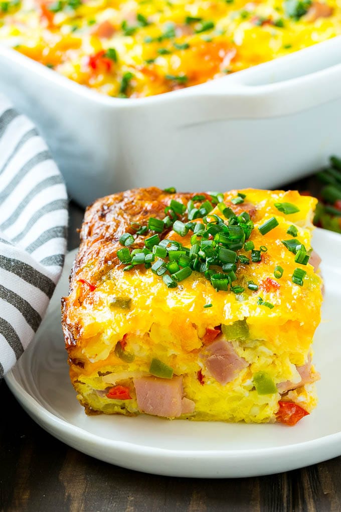 Hash Brown Egg Casserole Recipe | Breakfast Casserole with Ham | Hash Brown Casserole | Ham and Egg Casserole | Egg Casserole with Ham #casserole #breakfast #eggs #egg #hashbrown #bajap A cut slice of hash brown casserole.