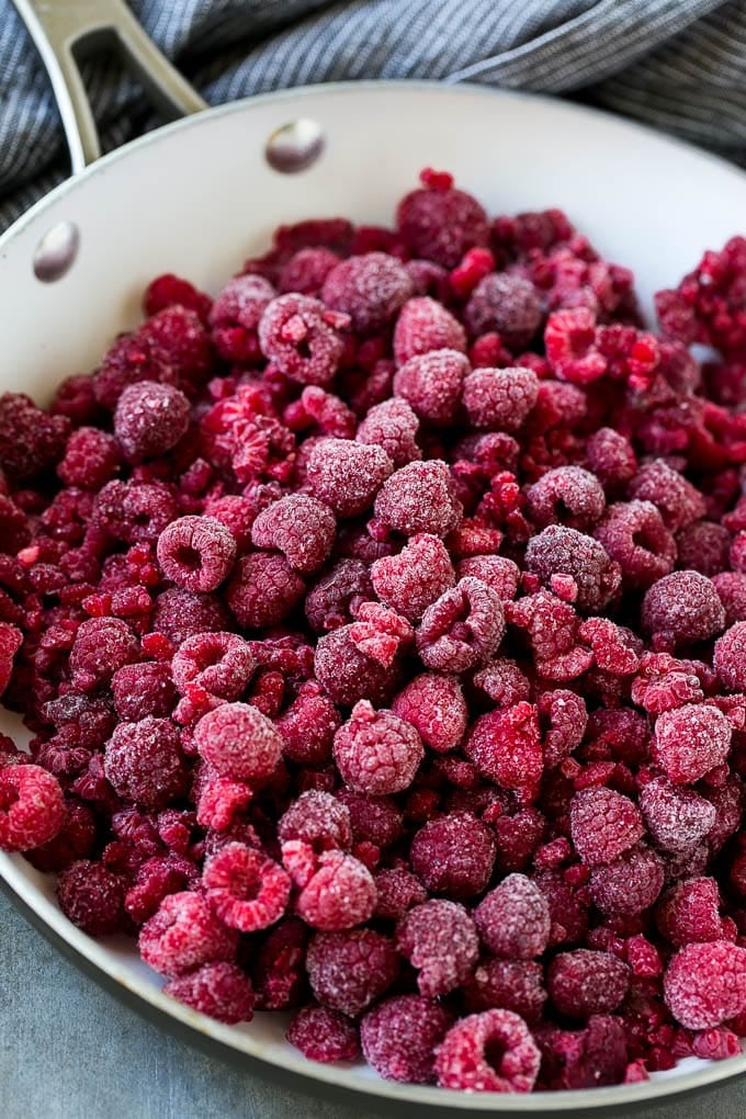 Raspberry Sauce Recipe | Homemade Raspberry Sauce | Raspberry Recipe #raspberries #dessert #bajap A pan of frozen berries.