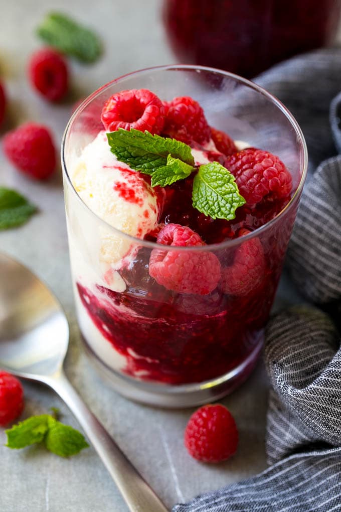Raspberry Sauce Recipe | Homemade Raspberry Sauce | Raspberry Recipe #raspberries #dessert #bajap A cup of vanilla ice cream with raspberry sauce and fresh raspberries.