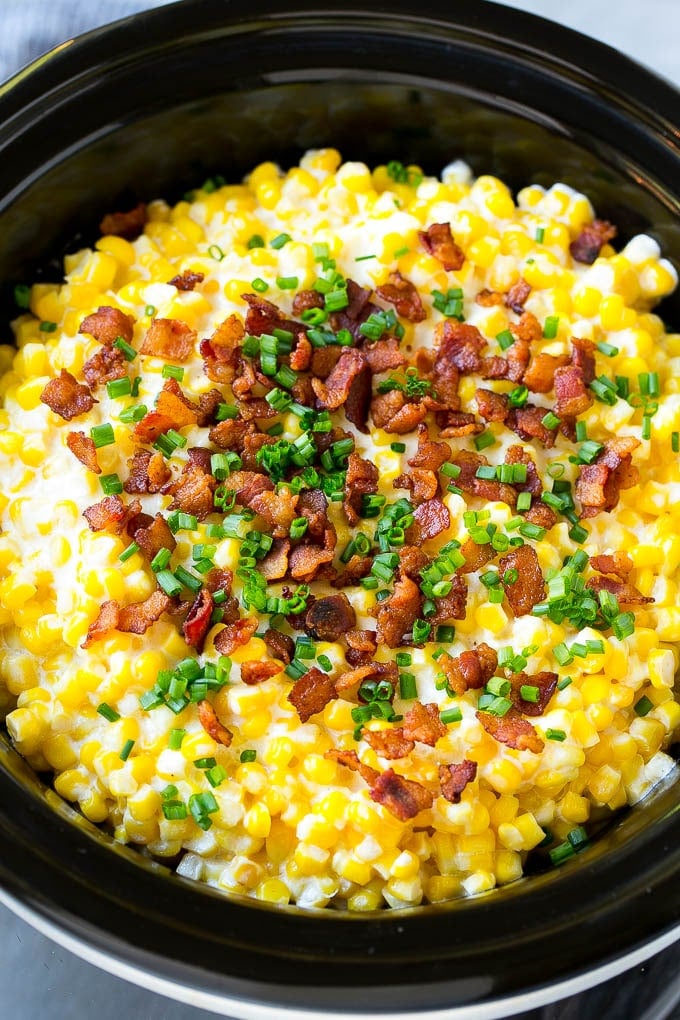 Slow Cooker Creamed Corn Recipe | Easy Creamed Corn Recipe | Slow Cooker Creamed Corn with Bacon | Southern Creamed Corn | Creamed Corn with Cream Cheese #creamedcorn #corn #bacon #crockpot #slowcooker #dinner #bajap Slow cooker creamed corn topped with bacon and chives.