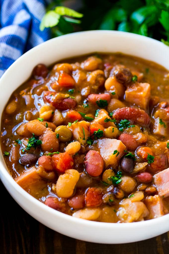 Slow Cooker Ham Bone Soup | Ham and Bean Soup | Ham Bone and Bean Soup | Ham Soup | Leftover Ham Recipe #ham #hamsoup #leftoverham #soup #slowcooker #crockpot #bajap A bowl of ham bone soup with beans and vegetables.