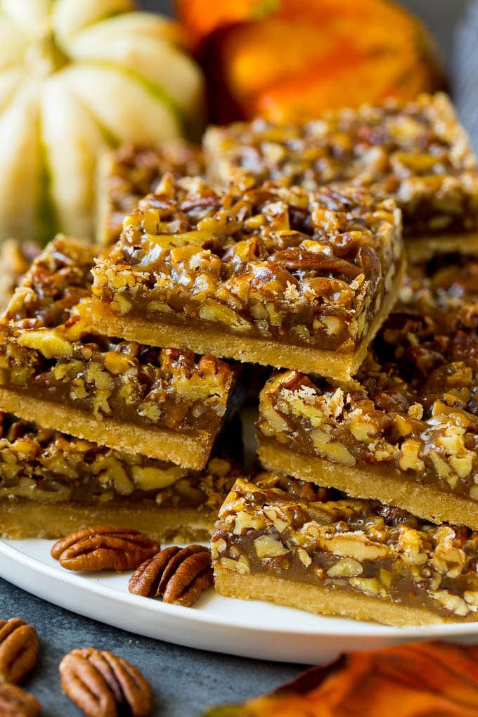 Pecan Pie Bars Recipe #pecans #pie #fall #pecanpie #dessert #thanksgiving #bajap A serving platter full of pecan pie bars.