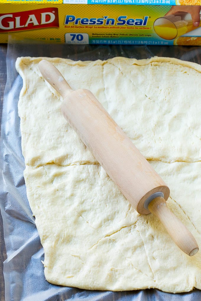 Veggie Pizza Recipe | Crescent Veggie Pizza | Vegetable Pizza Recipe | Holiday Appetizer | Homemade Veggie Pizza #pizza #veggies #vegetarian #appetizer #bajap Crescent roll dough rolled out into a rectangle.