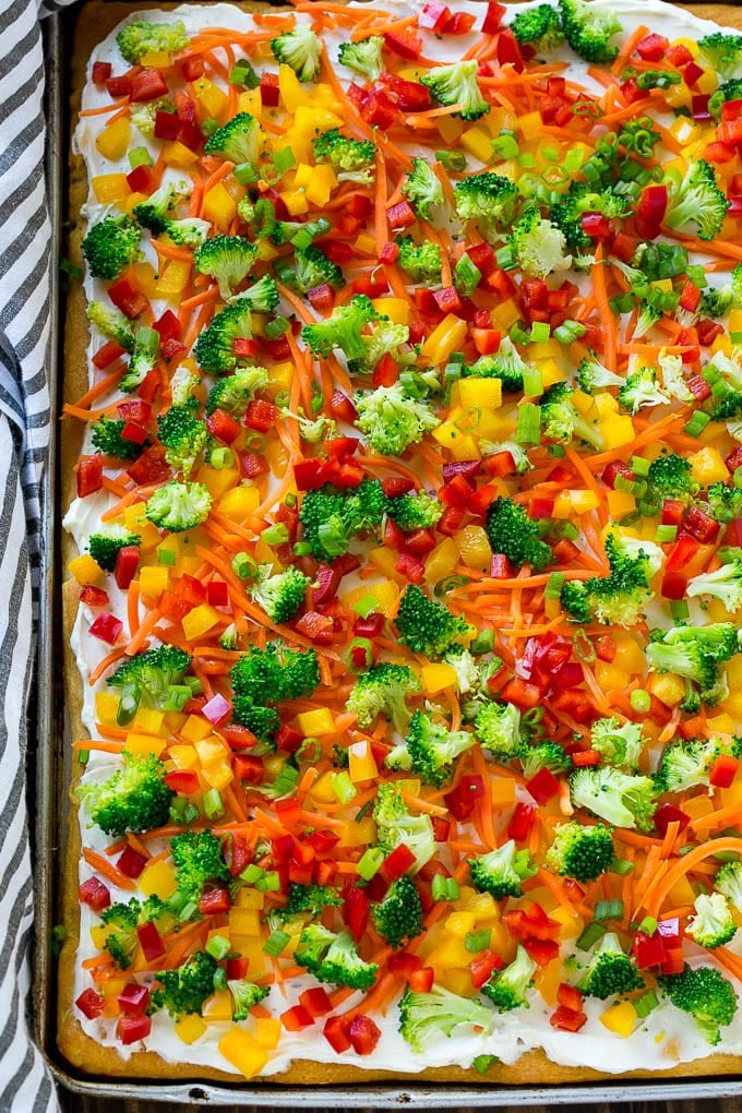 Veggie Pizza Recipe | Crescent Veggie Pizza | Vegetable Pizza Recipe | Holiday Appetizer | Homemade Veggie Pizza #pizza #veggies #vegetarian #appetizer #bajap A sheet pan of crescent veggie pizza.