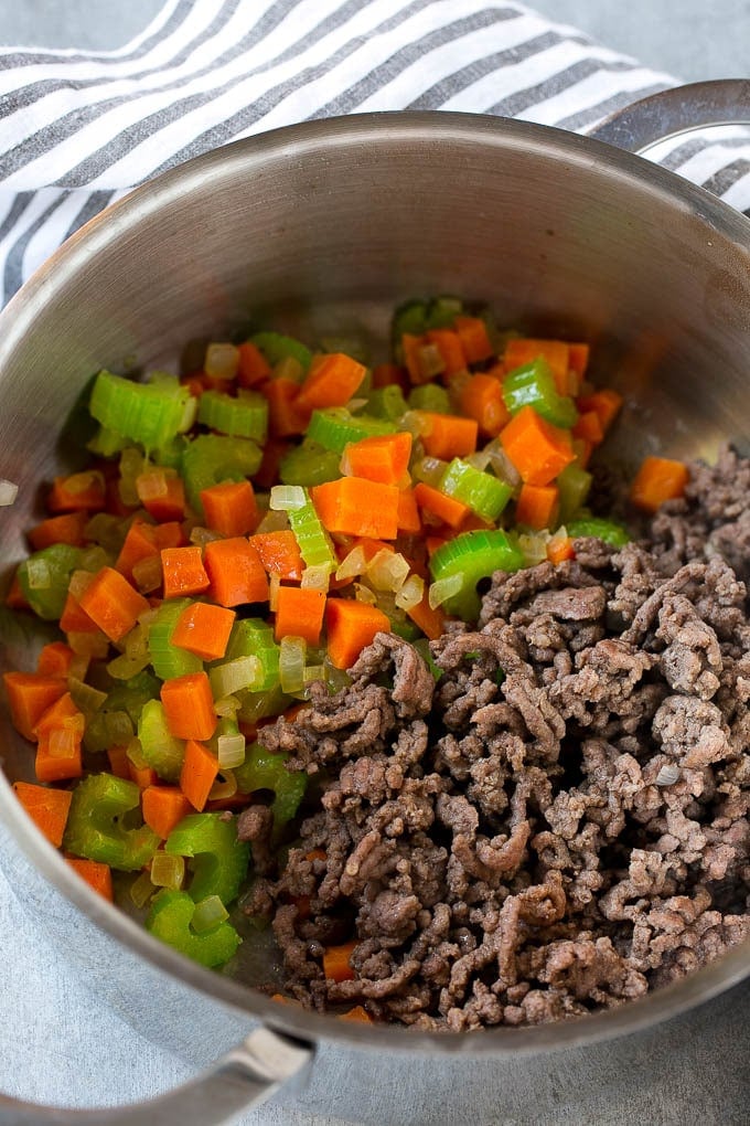 Hamburger Soup Recipe | Hamburger Stew | Ground Beef Soup #hamburger #soup #groundbeef #stew #dinner #bajap Ground beef is added to the vegetables in a pot.