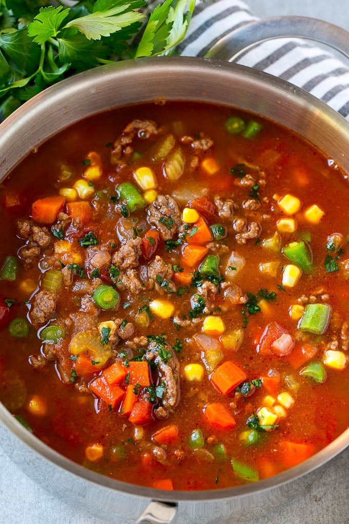 Hamburger Soup Recipe | Hamburger Stew | Ground Beef Soup #hamburger #soup #groundbeef #stew #dinner #bajap A pot of hamburger soup filled with cooked ground beef, veggies and seasonings.