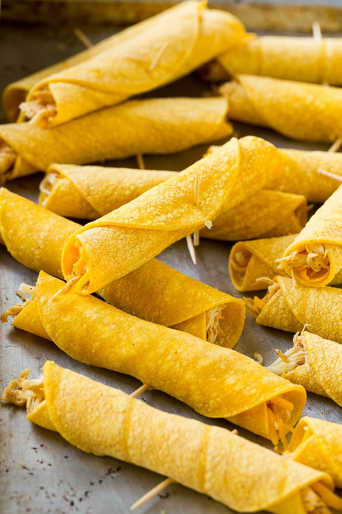 Chicken Taquitos Recipe | Baked Chicken Taquitos | Fried Chicken Taquitos | Mexican Appetizer | Chicken Tortillas #taquitos #chicken #appetizer #tortillas #mexicanfood #bajap Rolled up chicken taquitos ready for the fryer or oven.