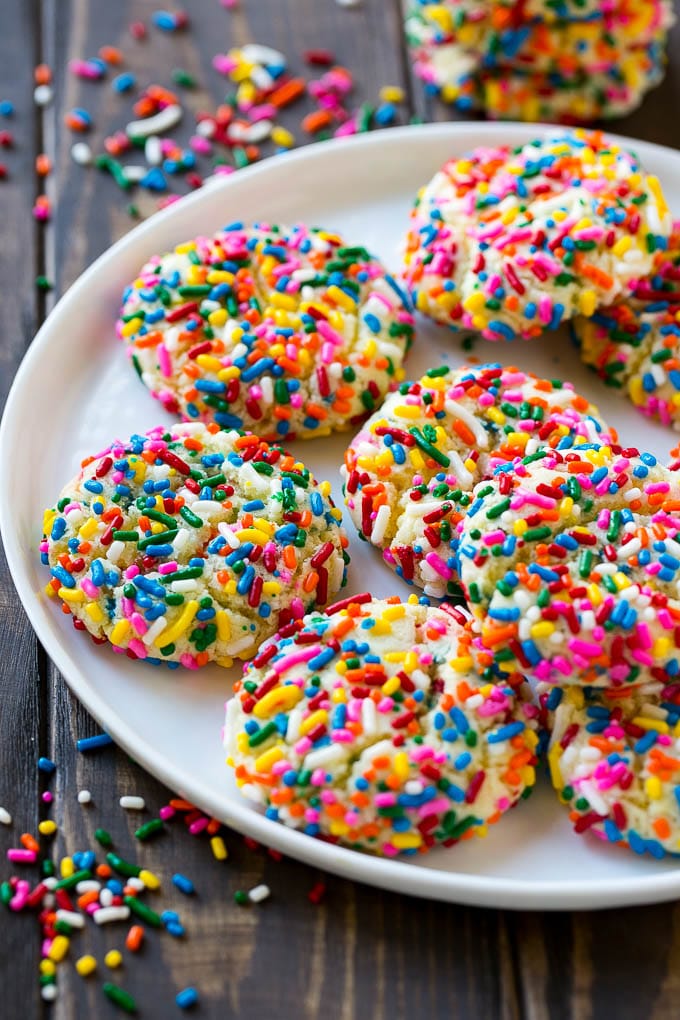 Funfetti Cookies Recipe | Funfetti Cake Mix Cookies | Sprinkle Cookies | Cake Mix Cookies #cookies #funfetti #sprinkles #dessert #bajap A plate of funfetti cookies coverd in rainbow sprinkles.