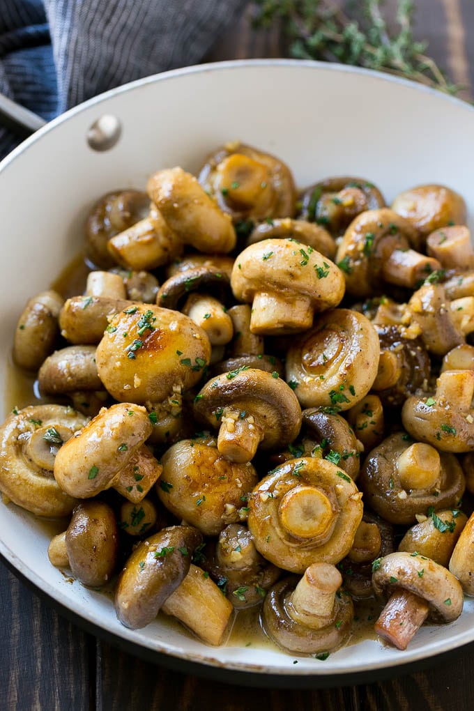 Garlic Mushrooms Recipe | Steakhouse Mushrooms | Sauteed Mushrooms | Garlic Butter Mushrooms | Mushroom Side Dish #mushrooms #butter #keto #lowcarb #dinner #sidedish #bajap A pan full of cooked mushrooms coated in garlic butter.
