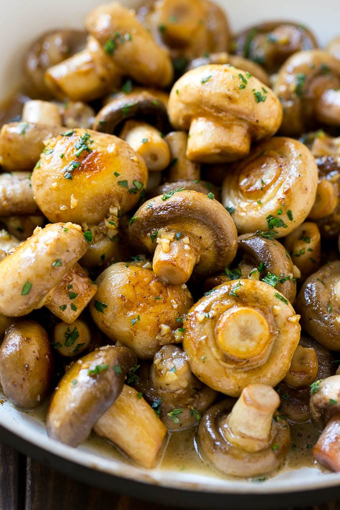 Garlic Mushrooms Recipe | Steakhouse Mushrooms | Sauteed Mushrooms | Garlic Butter Mushrooms | Mushroom Side Dish #mushrooms #butter #keto #lowcarb #dinner #sidedish #bajap Garlic mushrooms in an herb and butter sauce in a frying pan.