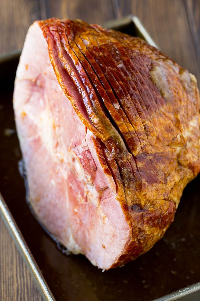 Coca Cola Ham | Coke Glazed Ham | Easter Ham | Christmas Ham | Holiday Ham Recipe #ham #easter #christmas #dinner #bajap An uncooked spiral ham topped with coke and brown sugar.