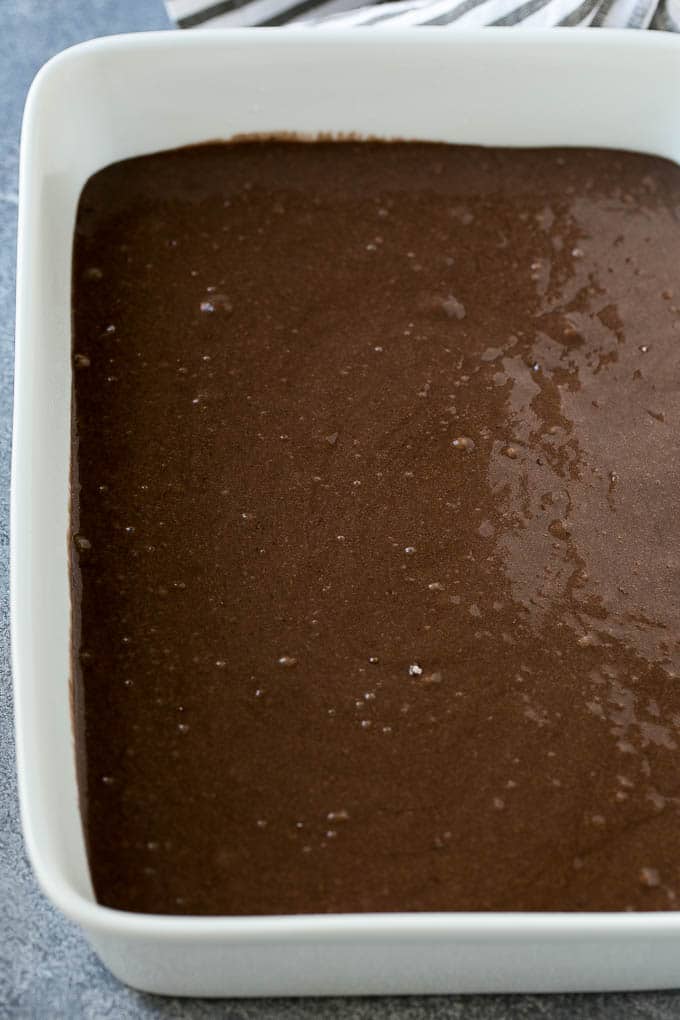 Earthquake Cake Recipe | Chocolate Cake Recipe | Chocolate Coconut Cake | Coconut Pecan Cake #cake #chocolate #coconut #pecans #dessert #chocolatecake #bajap Chocolate cake batter in a baking dish.