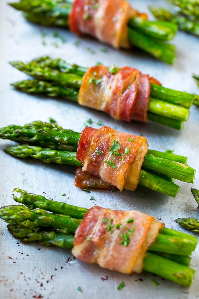 Bacon Wrapped Asparagus Recipe | Roasted Asparagus | Asparagus Side Dish #asparagus #bacon #sidedish #dinner #bajap Roasted asparagus in bundles on a sheet pan.