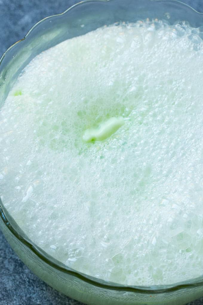 Lime Sherbet Punch | Party Punch Recipe | Sherbet Punch Recipe | Limeade Recipe #sherbet #punch #lime #drink #bajap Soda that has been poured into a large bowl.