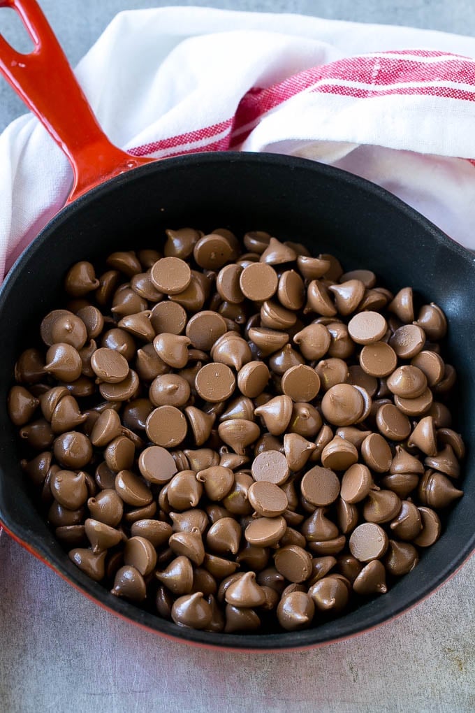 S'mores Dip Recipe | S'mores Skillet | Baked S'mores #smores #dip #chocolate #marshmallow #dessert #bajap A skillet of milk chocolate chips.