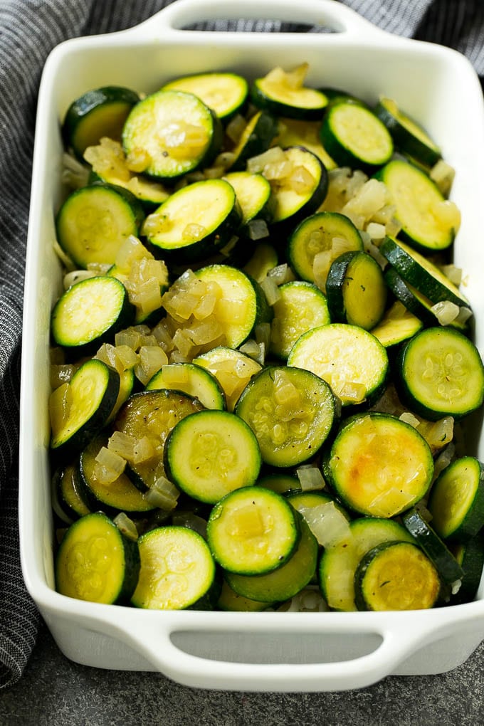 Zucchini Gratin Recipe | Cheesy Zucchini | Baked Zucchini | Easy Zucchini Recipe #zucchini #casserole #cheese #dinner #sidedish #bajap Sauteed zucchini and onions in a baking dish.