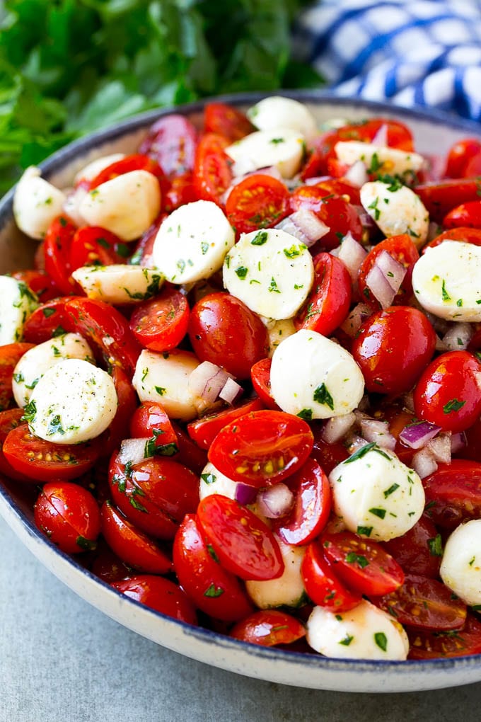Cherry Tomato Salad Recipe | Tomato Mozzarella Salad | Caprese Salad | Tomato Salad #tomatoes #salad #tomatosalad #caprese #bajap Cherry tomato salad with halved cherry tomatoes, mozzarella balls and red onion, all tossed with herbs and dressing.