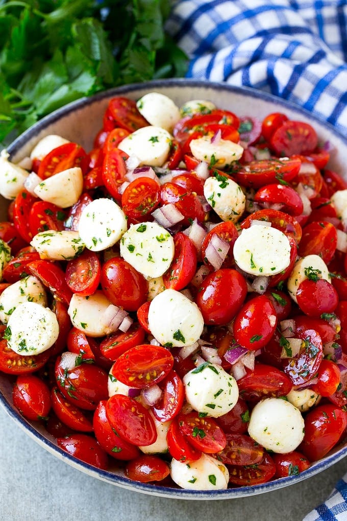 Cherry Tomato Salad Recipe | Tomato Mozzarella Salad | Caprese Salad | Tomato Salad #tomatoes #salad #tomatosalad #caprese #bajap A serving bowl of tomato mozzarella salad with cherry tomatoes, herbs and red onion.