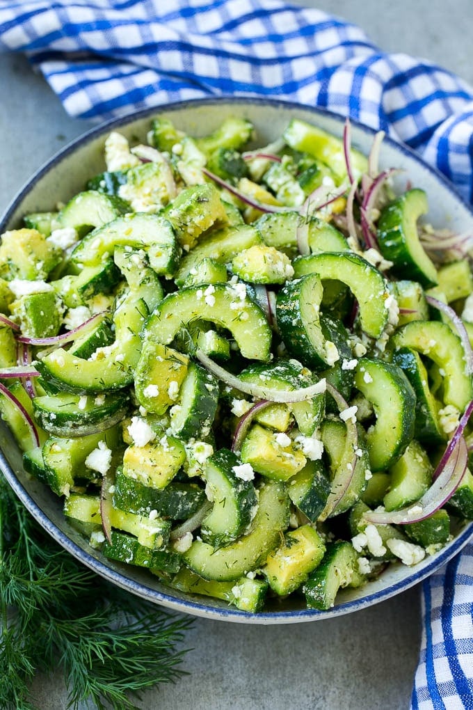Cucumber Feta Salad Recipe | Cucumber Salad | Feta Cheese Salad | Summer Salad #salad #cucumber #bajap A bowl of cucumber feta salad with avocado.