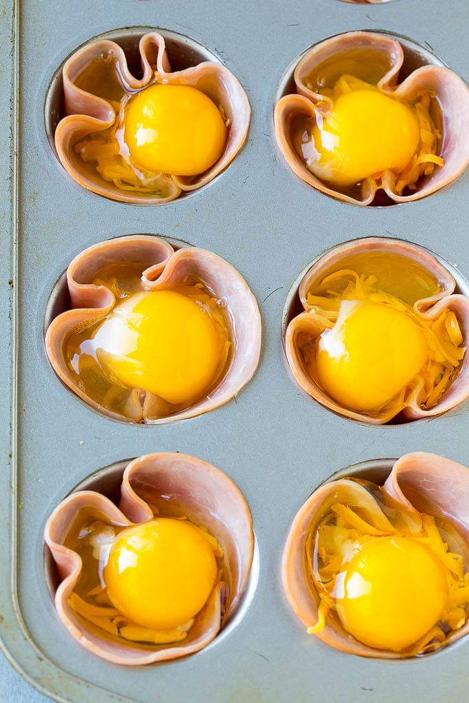 Ham and Egg Cups Recipe | Low Carb Breakfast | Ham and Eggs #ham #eggs #lowcarb #breakfast #bajap Ham pressed into muffin tins and topped with eggs and cheese.