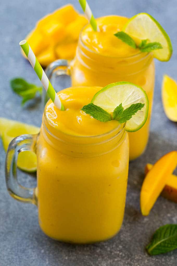 Mango Smoothie Recipe | Mango Recipe | Healthy Smoothie #mango #smoothie #drink #bajap Mango smoothie in a mug topped with a slice of lime and mint sprig.