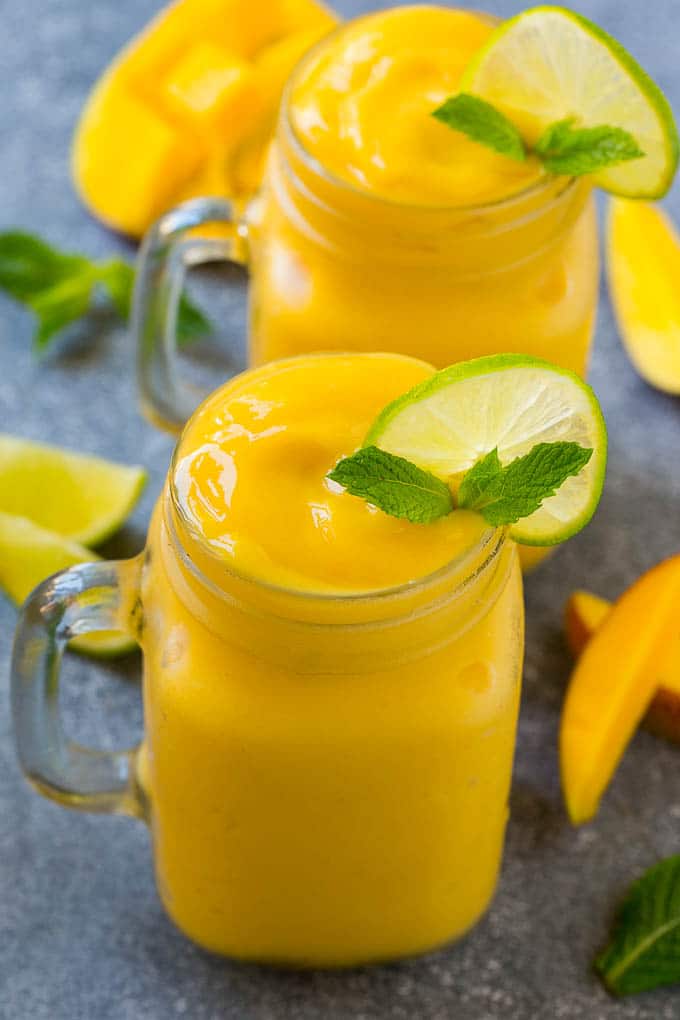 Mango Smoothie Recipe | Mango Recipe | Healthy Smoothie #mango #smoothie #drink #bajap Mango smoothie in a mason jar mug.