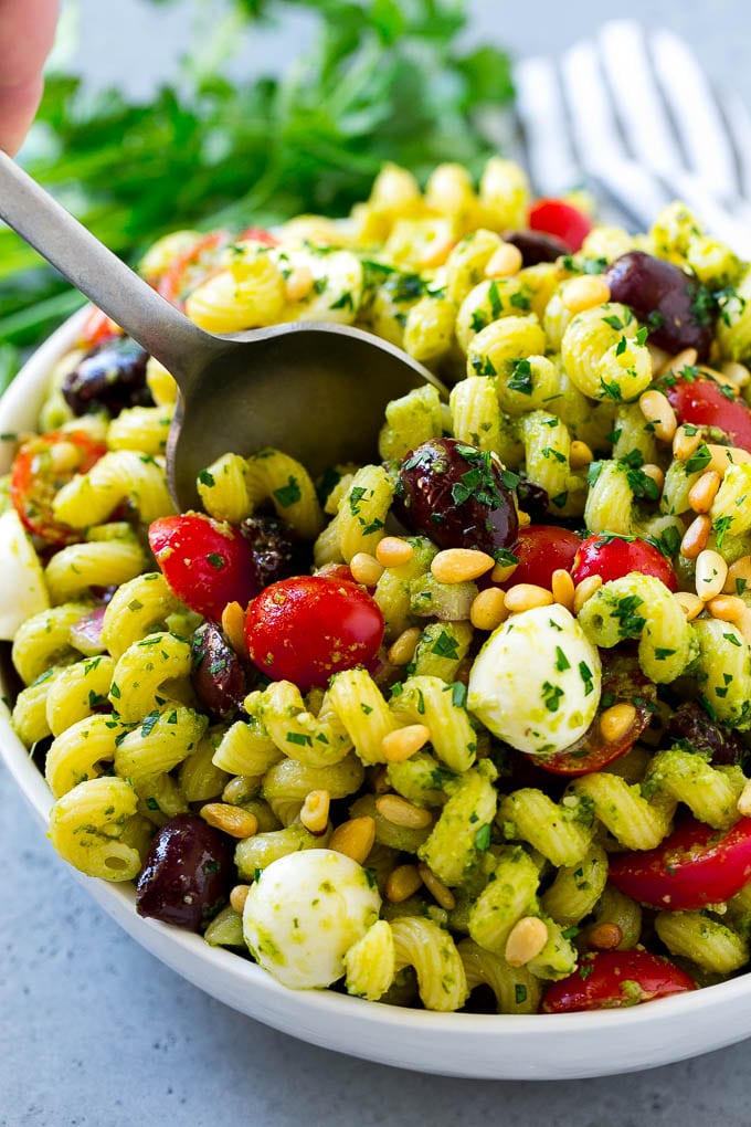 Pesto Pasta Salad | Italian Pasta Salad | Easy Pasta Salad #pasta #salad #pesto #olives #tomatoes #bajap Pesto pasta salad with cherry tomatoes, olives, mozzarella balls, pine nuts and red onion.