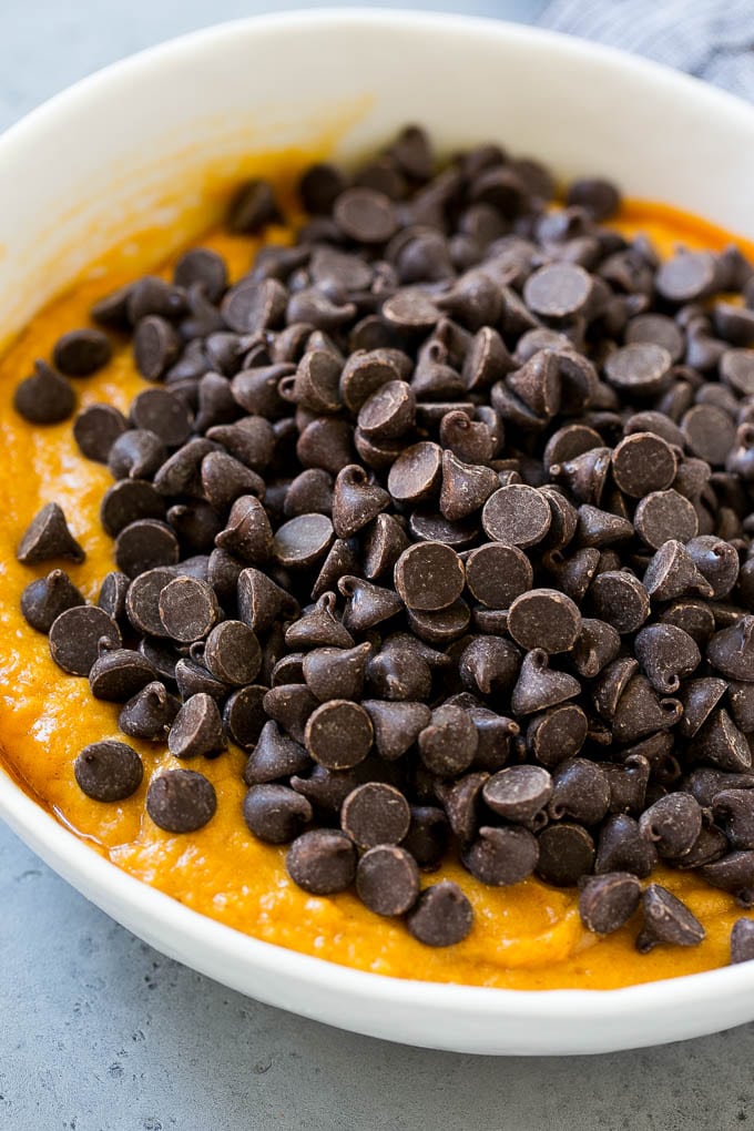 Pumpkin Chocolate Chip Cookies Recipe | Pumpkin Cookies | Pumpkin Chocolate Cookies #pumpkin #cookies #chocolate #baking #fall #bajap #dessert Batter with chocolate chips on top in a bowl.
