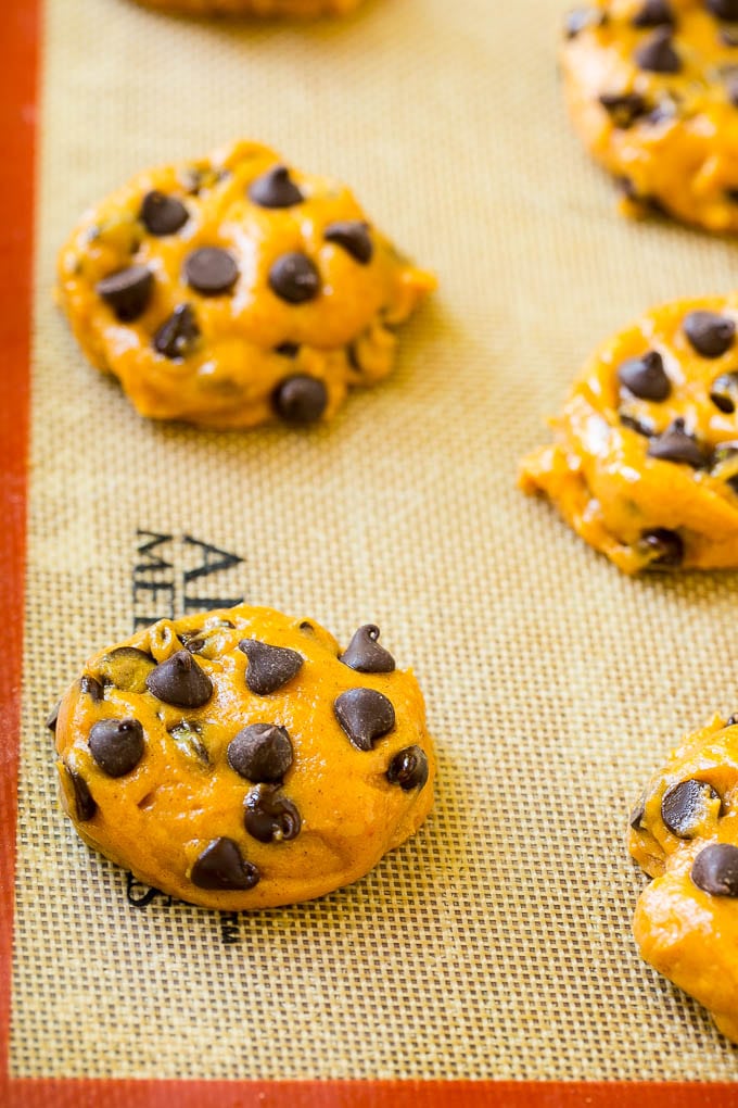 Pumpkin Chocolate Chip Cookies Recipe | Pumpkin Cookies | Pumpkin Chocolate Cookies #pumpkin #cookies #chocolate #baking #fall #bajap #dessert Dollops of dough on a baking sheet.