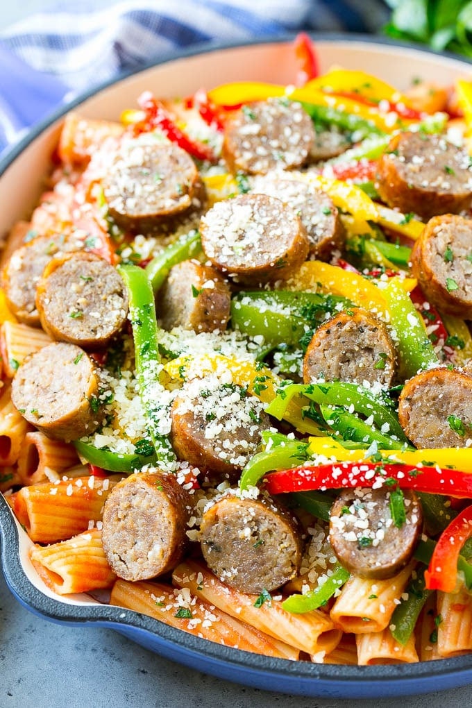 Sausage and Pepper Pasta Recipe | Italian Sausage Recipe | Sausage and Peppers | Easy Pasta #pasta #sausage #peppers #dinner #bajap Sausage and pepper pasta with sliced Italian sausage, red and yellow bell peppers and grated parmesan cheese.
