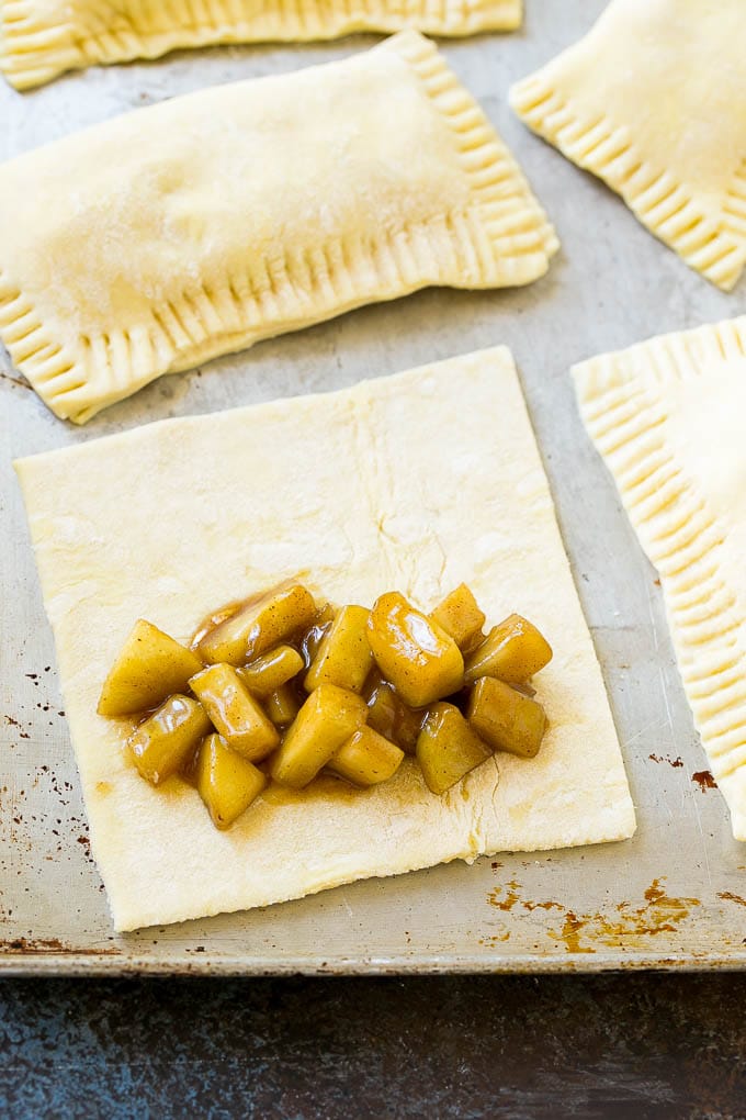 Fried Apple Pies Recipe | McDonald's Copycat Recipe | Apple Pie | Apple Hand Pies #pie #apples #applepie #dessert #snack #bajap A sheet of puff pastry topped with homemade apple pie filling.