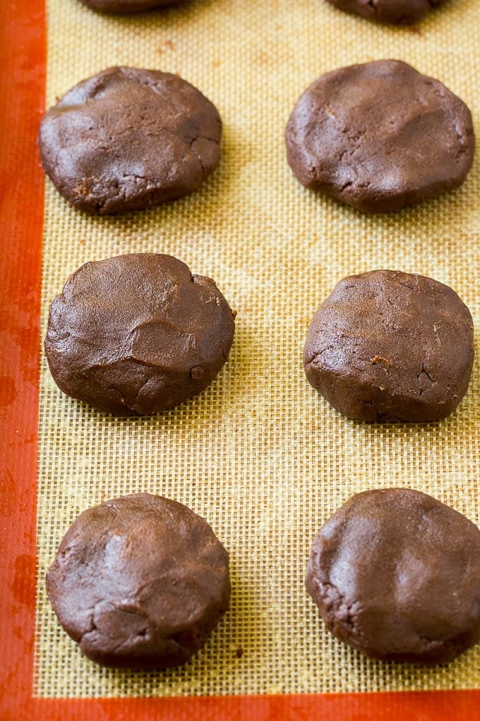 Nutella Cookies Recipe | Nutella Stuffed Cookies | Chocolate Cookies #nutella #chocolate #cookies #baking #dessert #bajap Nutella cookie dough on a baking sheet.
