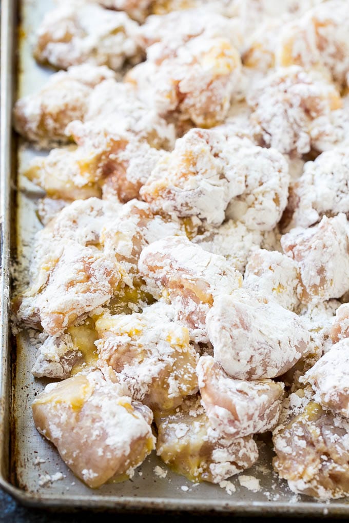 Orange Chicken Recipe | Chinese Orange Chicken | Panda Express Orange Chicken #orange #chicken #takeout #chinesefood #dinner #bajap Chicken pieces coated in egg and flour.