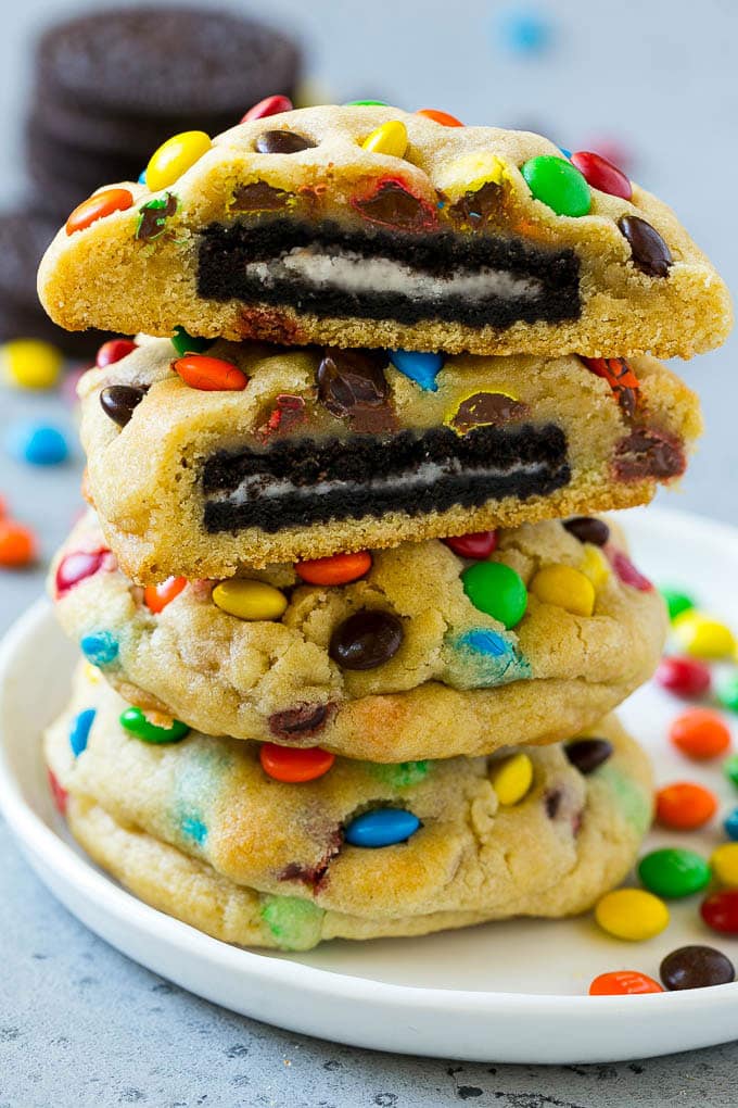 Oreo Stuffed Cookies Recipe | M&M's cookies | Stuffed Cookies #cookies #chocolate #oreos #dessert #baking #bajap A stack of Oreo stuffed cookies on a plate.