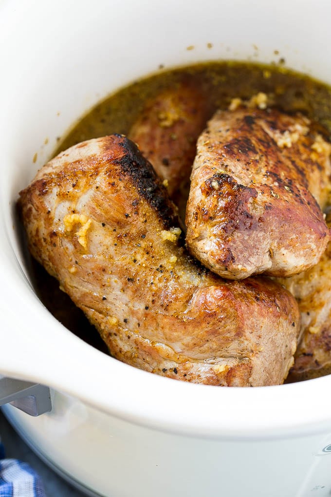 Slow Cooker Pork Tenderloin Recipe | Crock Pot Pork Tenderloin | Easy Pork Tenderloin #slowcooker #crockpot #pork #dinner #bajap Seared pork tenderloin in a slow cooker with seasonings.
