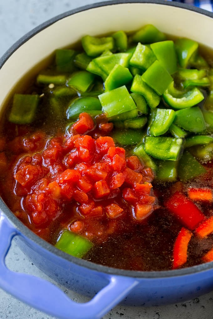 Stuffed Pepper Soup Recipe | Beef and Rice Soup | Stuffed Peppers #peppers #soup #beef #rice #dinner #bajap Ground beef, tomatoes, peppers and beef broth in a pot.