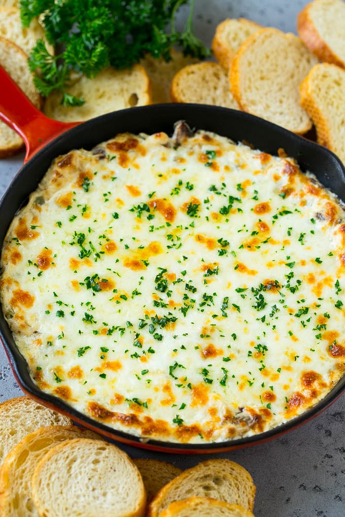 Philly Cheesesteak Dip Recipe | Cheesy Dip | Baked Cheese Dip #steak #dip #appetizer #cheese #bajap A skillet of baked Philly cheesesteak dip with melted cheese and parsley on top.