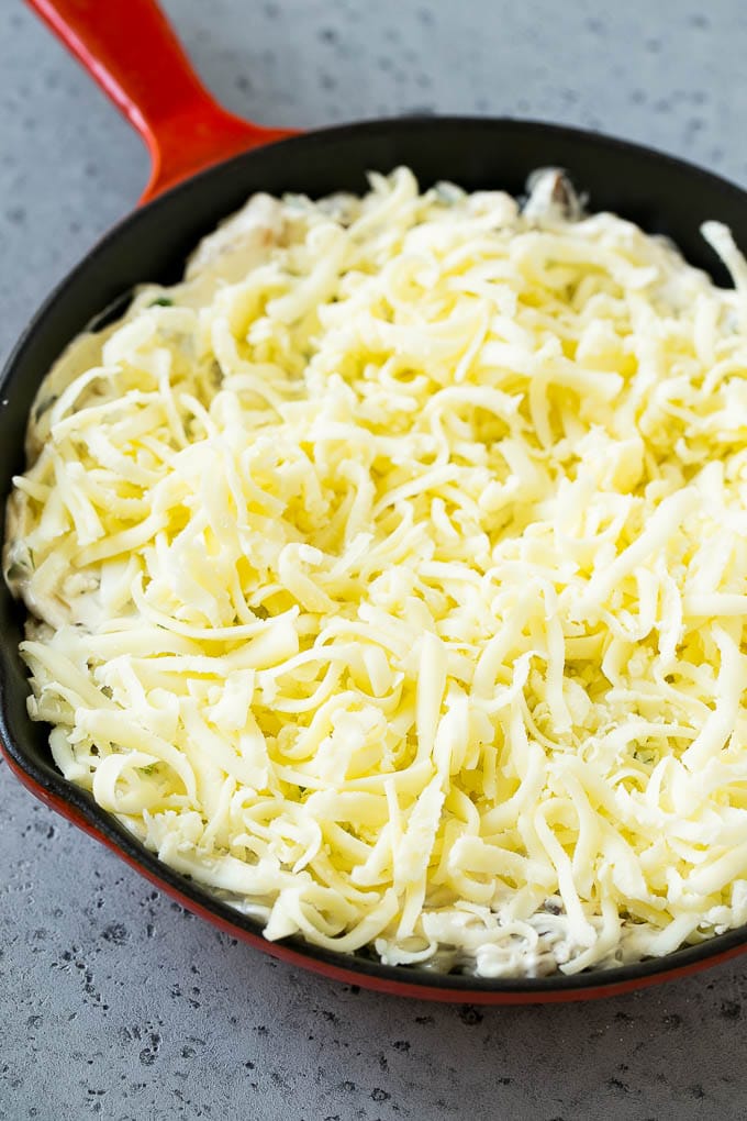 Philly Cheesesteak Dip Recipe | Cheesy Dip | Baked Cheese Dip #steak #dip #appetizer #cheese #bajap Philly cheesesteak dip with shredded cheese on top, waiting to go into the oven.