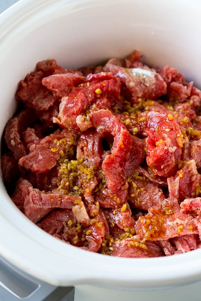 Slow Cooker Korean Beef Recipe | Korean Beef | Flank Steak Recipe #dinner #beef #slowcooker #crockpot #asian #bajap Flank steak strips in a soy, ginger and garlic sauce.