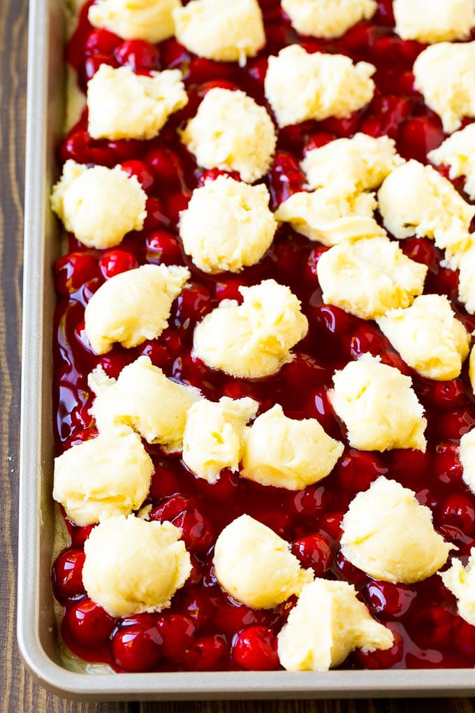 Cherry Bars Recipe | Cherry Pie Bars | Cherry Cookies | Bar Cookies #cookies #bars #cherry #baking #dessert #sweets #bajap Filling with dollops of cookie dough on top.