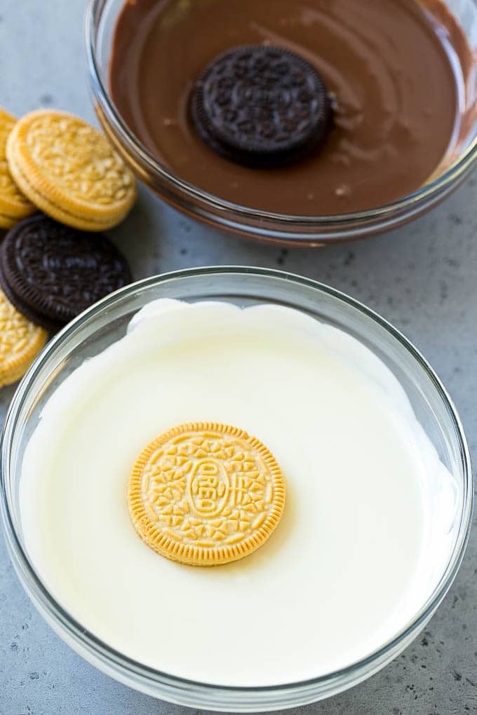 Chocolate Covered Oreos Recipe | Oreo Cookies | Chocolate Dipped Oreos #oreo #cookies #chocolate #sprinkles #dessert #bajap Cookies being dipped into dark and white chocolate.
