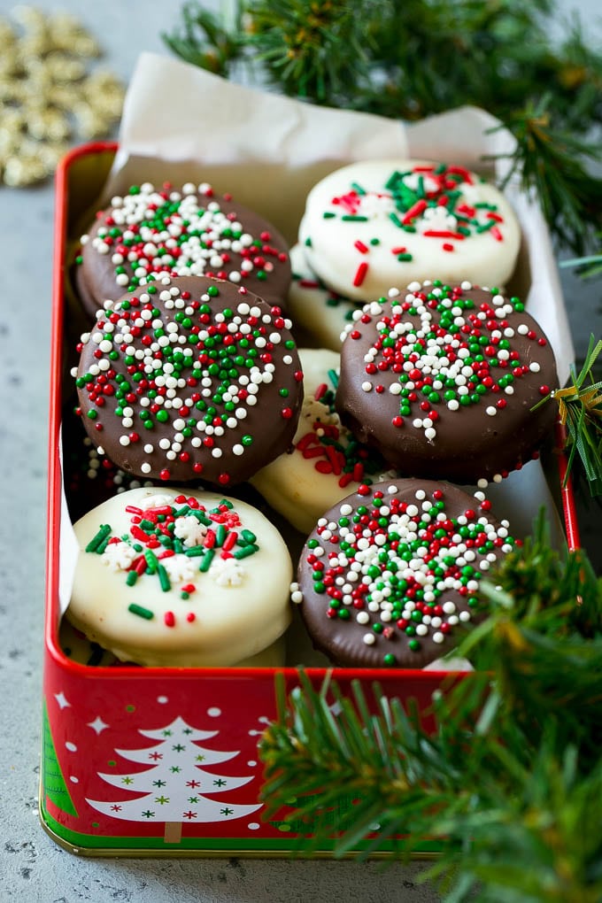 Chocolate Covered Oreos Recipe | Oreo Cookies | Chocolate Dipped Oreos #oreo #cookies #chocolate #sprinkles #dessert #bajap Christmas chocolate covered Oreos in a gift tin.