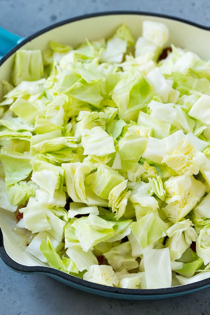Fried Cabbage Recipe | Cabbage with Bacon | Cabbage Side Dish #cabbage #bacon #sidedish #lowcarb #keto #bajap Bacon, onions and cabbage in a skillet.