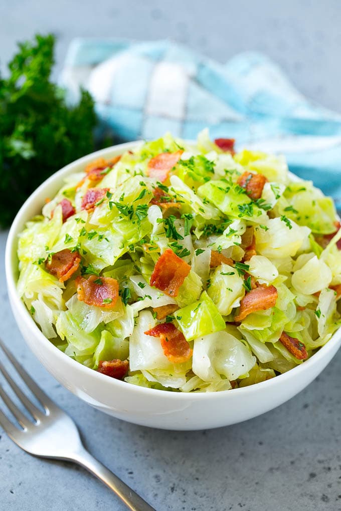 Fried Cabbage Recipe | Cabbage with Bacon | Cabbage Side Dish #cabbage #bacon #sidedish #lowcarb #keto #bajap A bowl of fried cabbage topped with bacon and parsley.