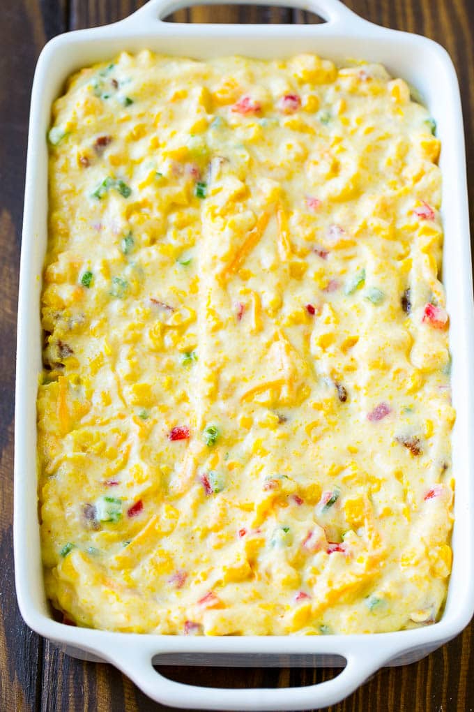 Loaded Corn Casserole Recipe | Easy Corn Casserole | Bacon Corn Casserole | Corn Pudding #corn #casserole #bacon #cheese #sidedish #thanksgiving #dinner #bajap Uncooked batter in a baking dish.