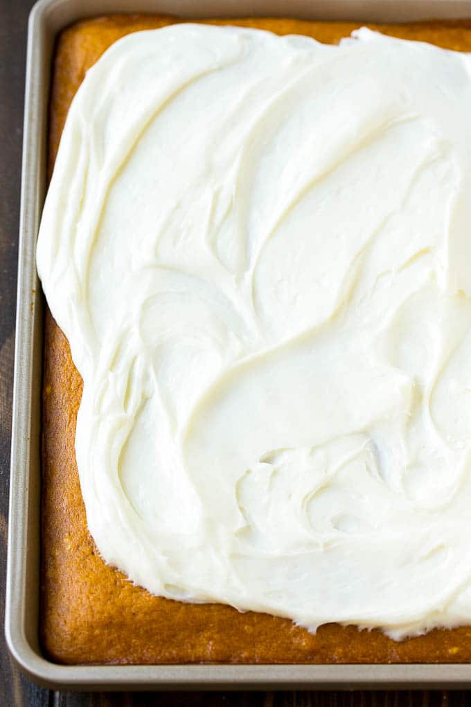 Pumpkin Bars Recipe | Pumpkin Cake | Pumpkin Dessert #pumpkin #fall #dessert #bajap #thanksgiving Cream cheese frosting spread over cake.